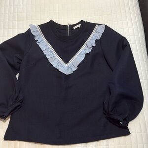 Navy and seersucker ruffle top
